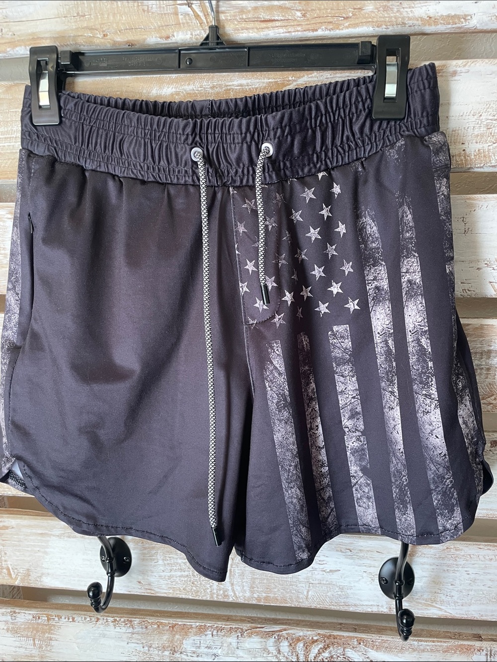 black tactical-style swim trunks by FT Fenteng | faded American flag has pockets